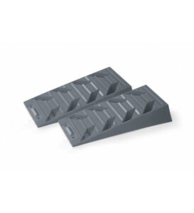 two gray plastic ramps for leveling or stabilizing equipment