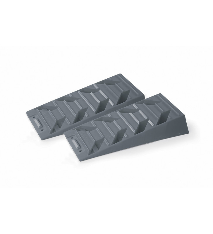 two gray plastic ramps for leveling or stabilizing equipment